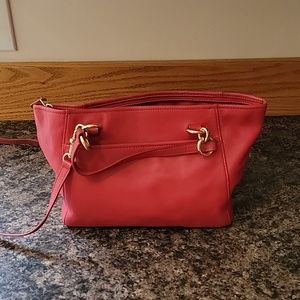 Coach leather shoulder bag with strap and handles.